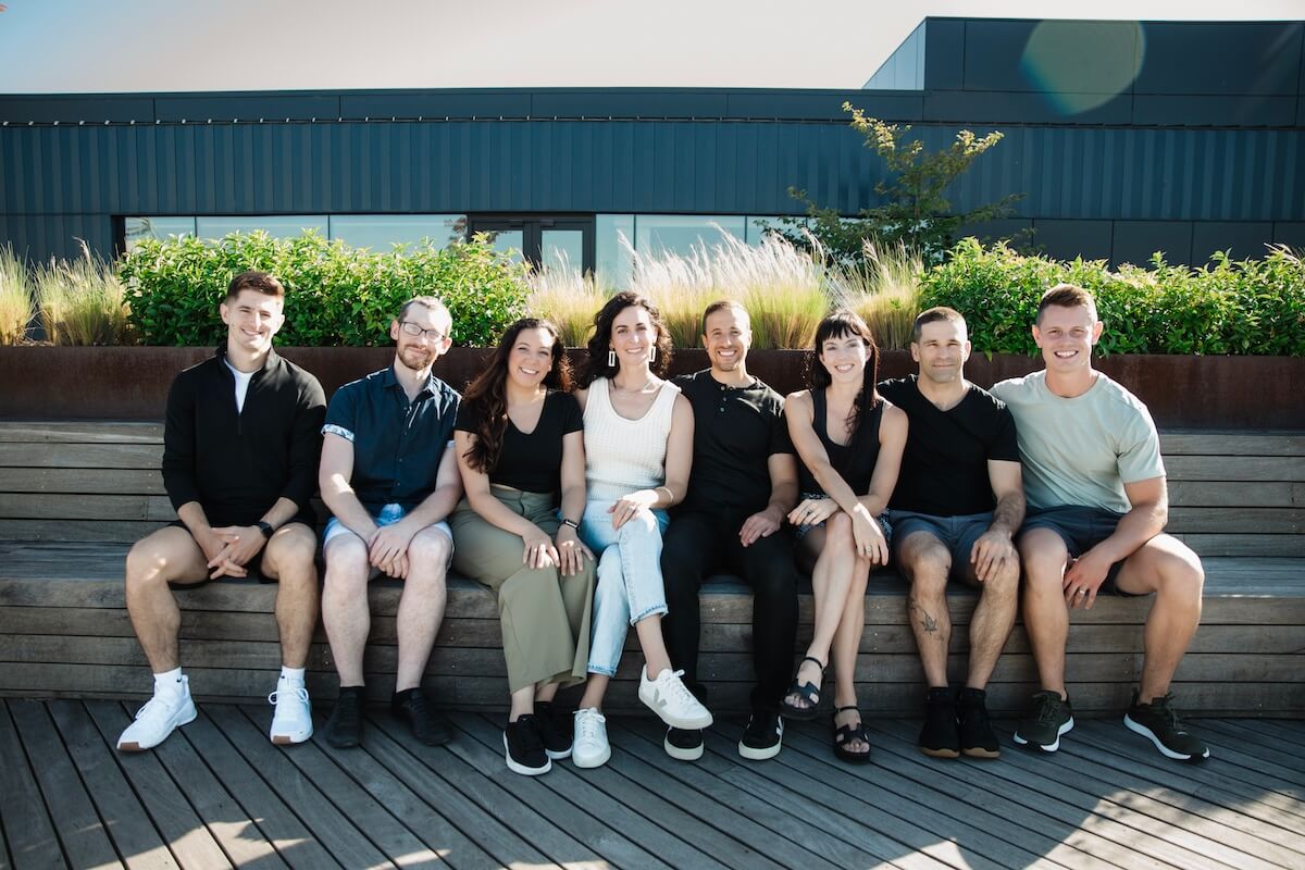 The Prime Performance team sits together outside of the clinic